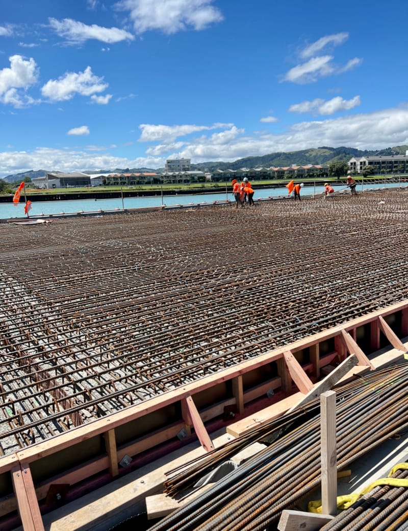 The fabricating, placing and fixing of Pile Plugs, Head Stocks, Capping Beams, Retaining walls and Deck Slabs.