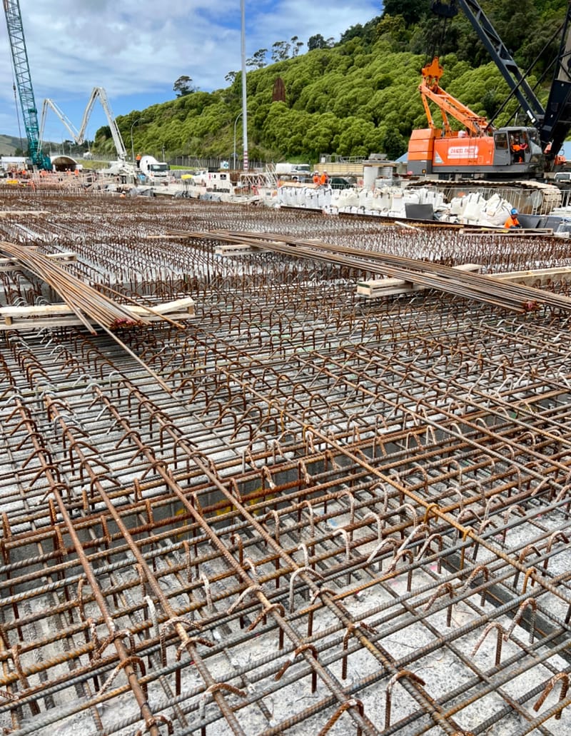 The fabricating, placing and fixing of Pile Plugs, Head Stocks, Capping Beams, Retaining walls and Deck Slabs.