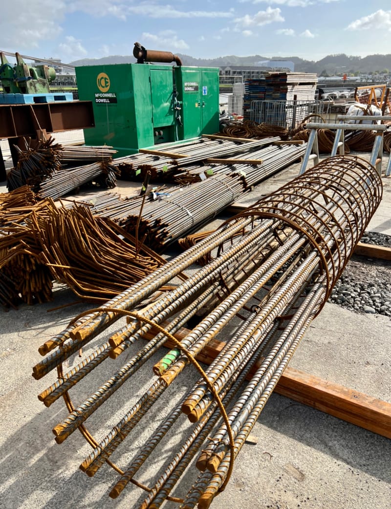 The fabricating, placing and fixing of Pile Plugs, Head Stocks, Capping Beams, Retaining walls and Deck Slabs.