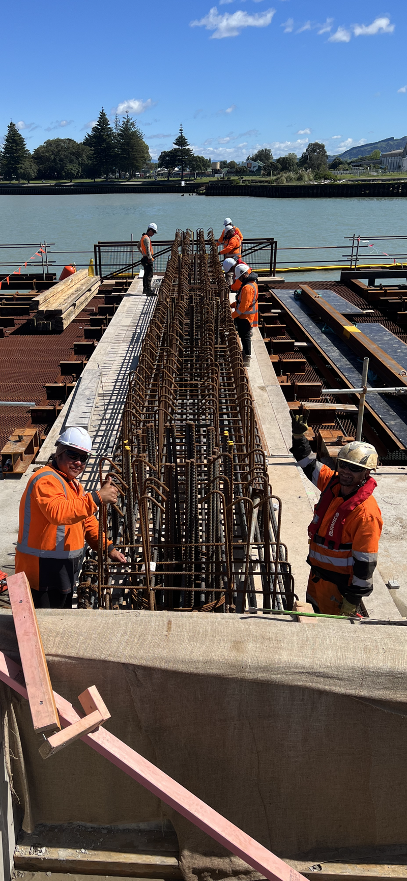 The fabricating, placing and fixing of Pile Plugs, Head Stocks, Capping Beams, Retaining walls and Deck Slabs.