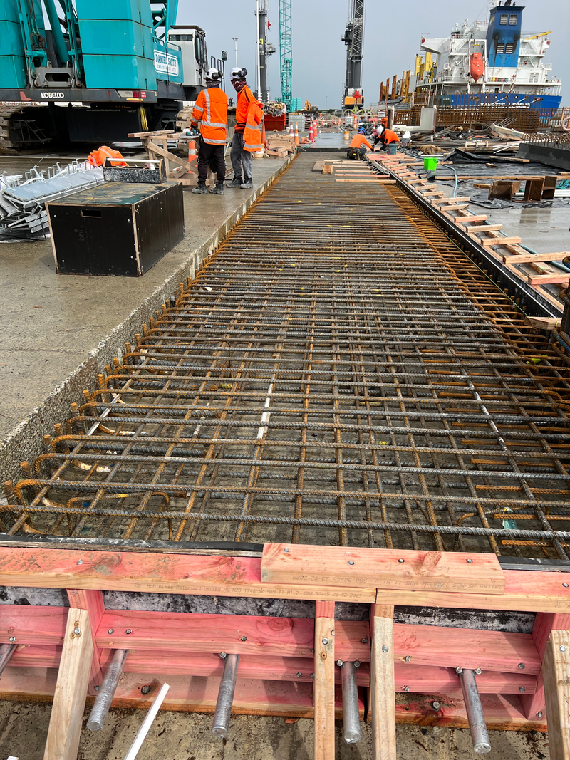 The fabricating, placing and fixing of Pile Plugs, Head Stocks, Capping Beams, Retaining walls and Deck Slabs.