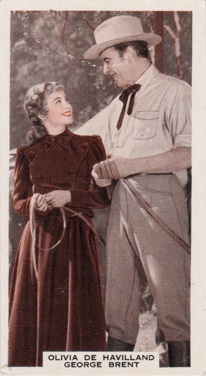 OLIVIA DE HAVILLAND AND GEORGE BRENT in "GOLD IS WHERE YOU FIND IT"