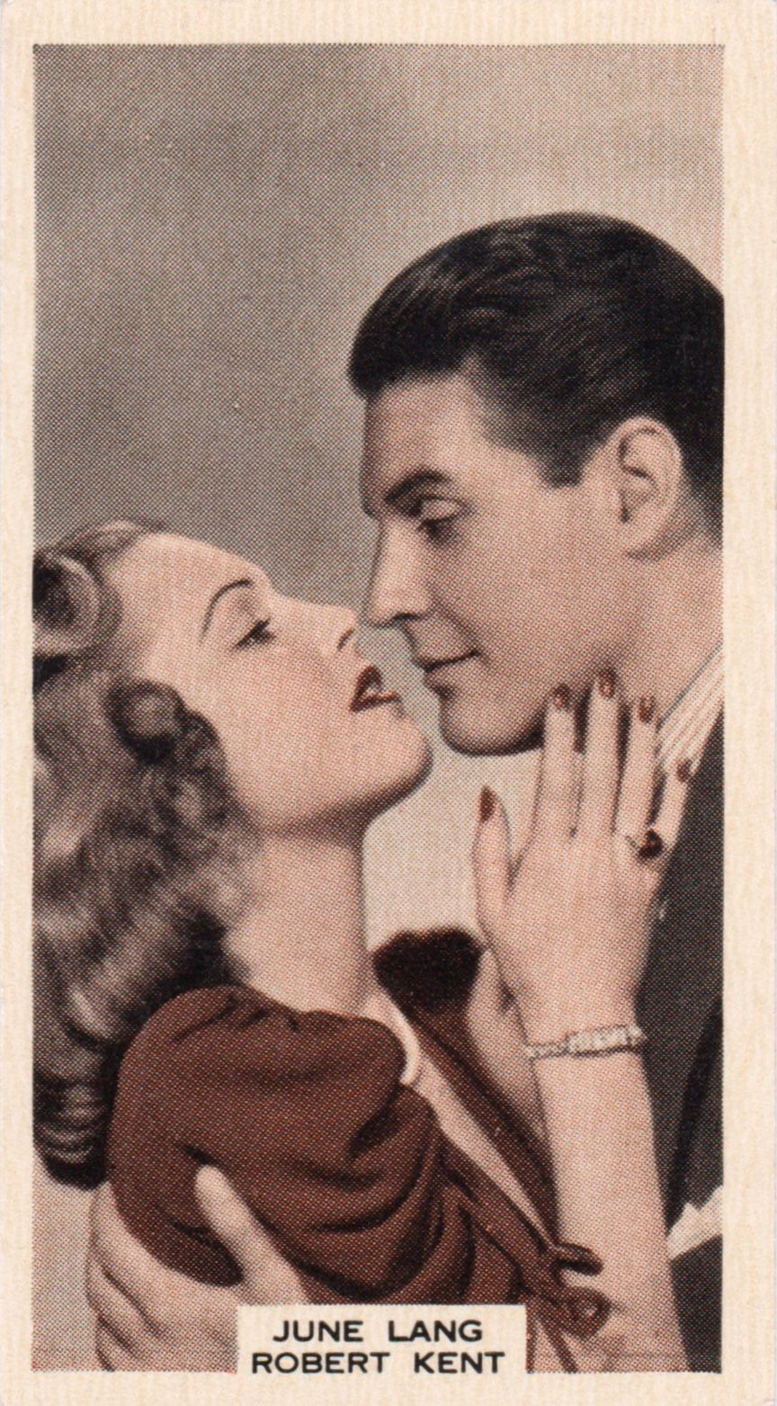 JUNE LANG AND ROBERT KENT in "TO-MORROW AT MIDNIGHT"