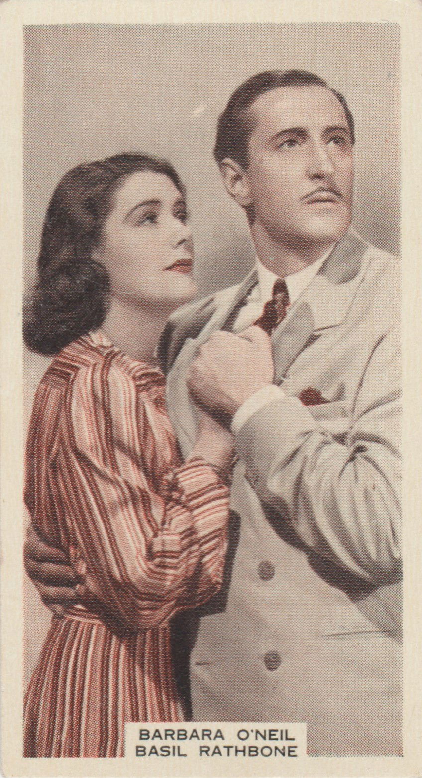 BARBARA O'NEIL AND BASIL RATHBONE in "THE SUN NEVER SETS"