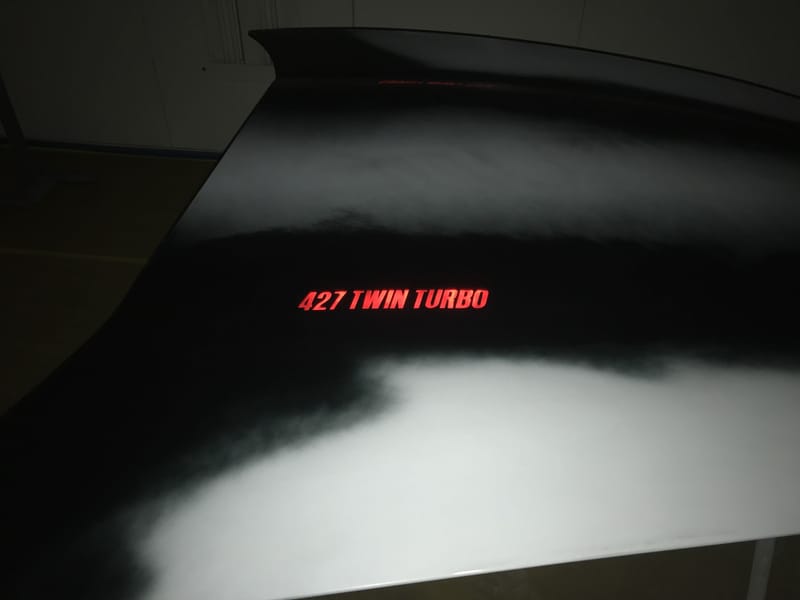 C6 toggle switch activated light up hood emblem