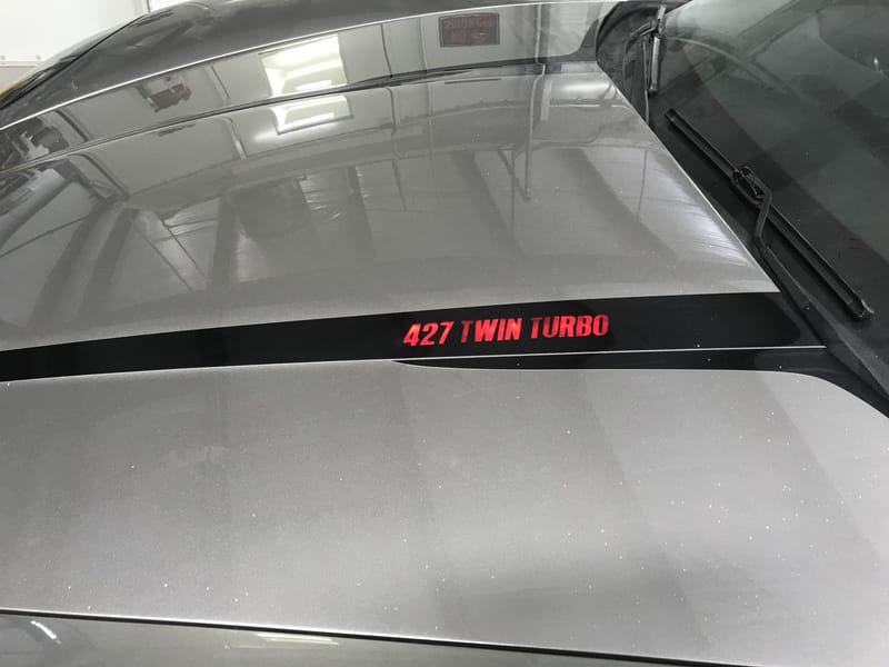 C6 toggle switch activated light up hood emblem