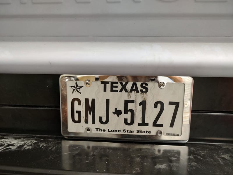 Hidden gas filler for a 49 Chevy truck, designed with a sliding license plate and magnets to avoid putting a large hole in the new wood bed.