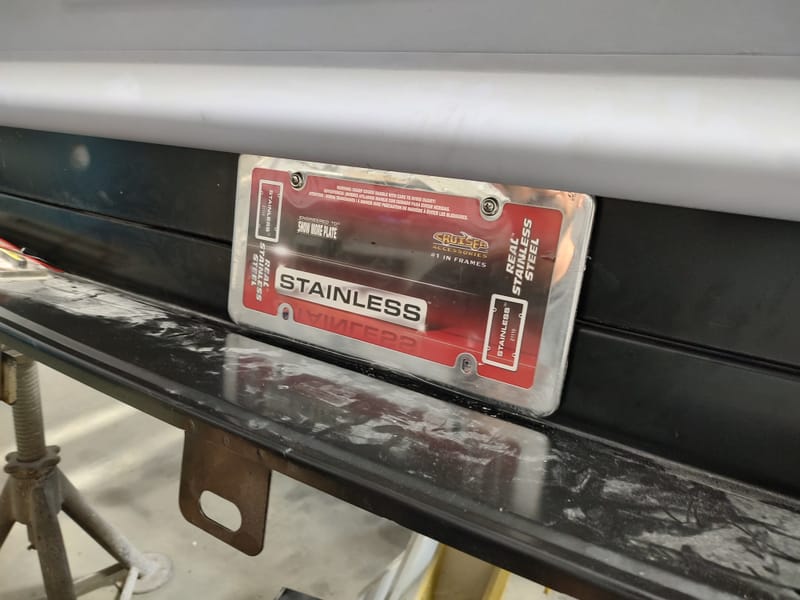 Hidden gas filler for a 49 Chevy truck, designed with a sliding license plate and magnets to avoid putting a large hole in the new wood bed.