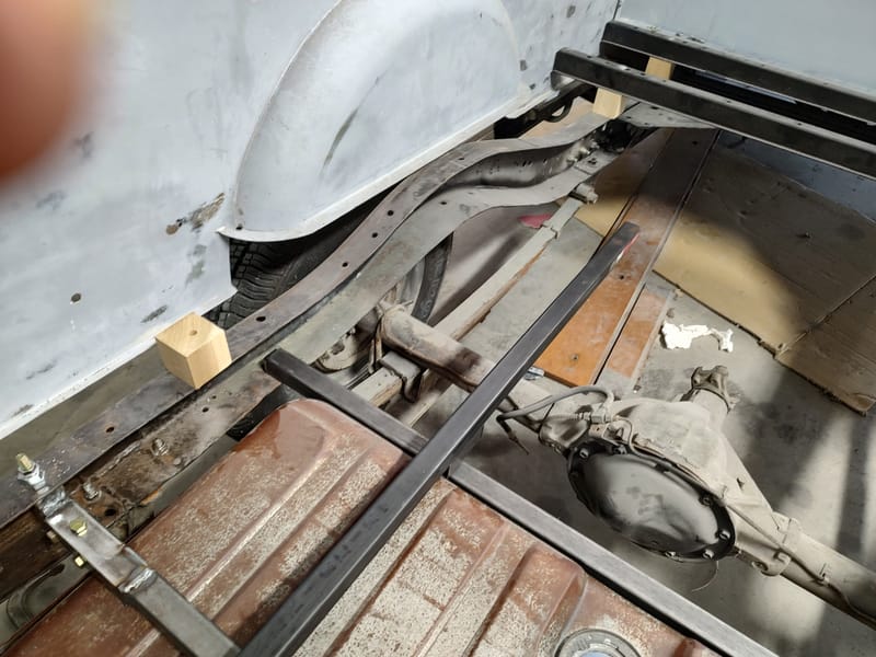 Hidden gas filler for a 49 Chevy truck, designed with a sliding license plate and magnets to avoid putting a large hole in the new wood bed.