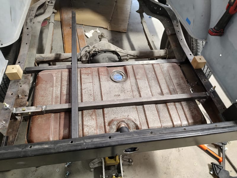 Hidden gas filler for a 49 Chevy truck, designed with a sliding license plate and magnets to avoid putting a large hole in the new wood bed.