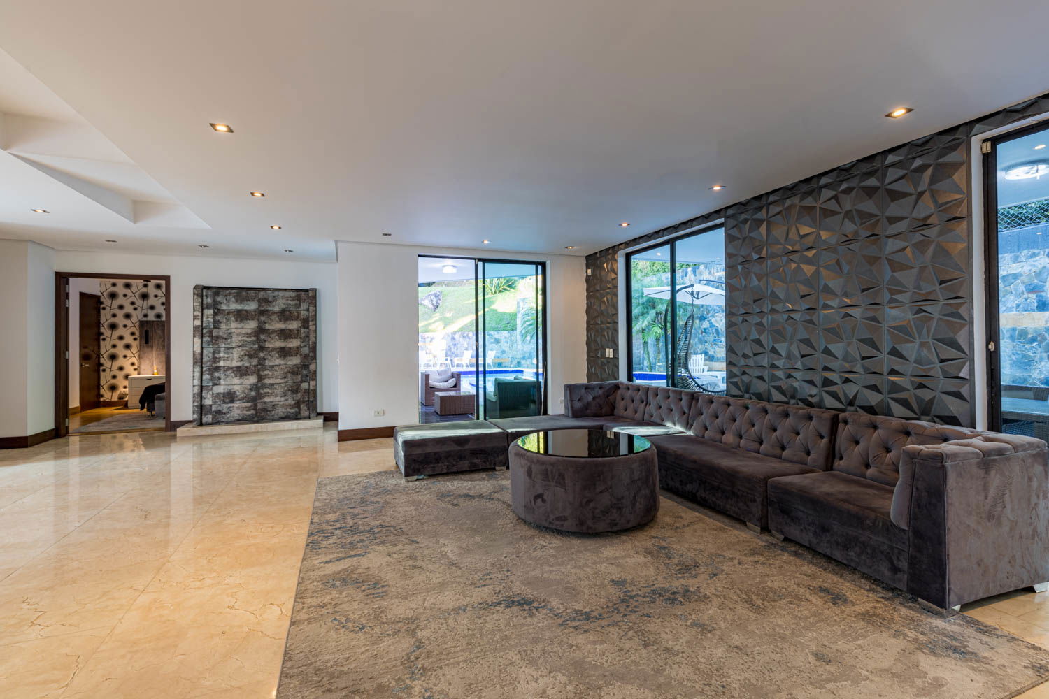 Immerse Yourself in Sophistication: Experience Unparalleled Comfort and Style in the Enchanting Living Room of our Medellin Villa"