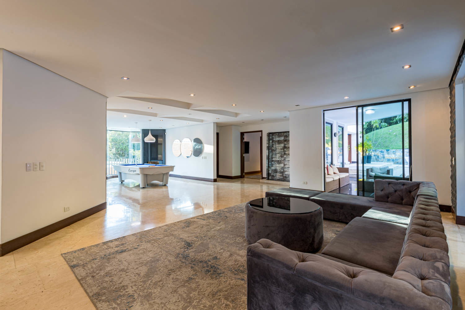 Immerse Yourself in Sophistication: Experience Unparalleled Comfort and Style in the Enchanting Living Room of our Medellin Villa"