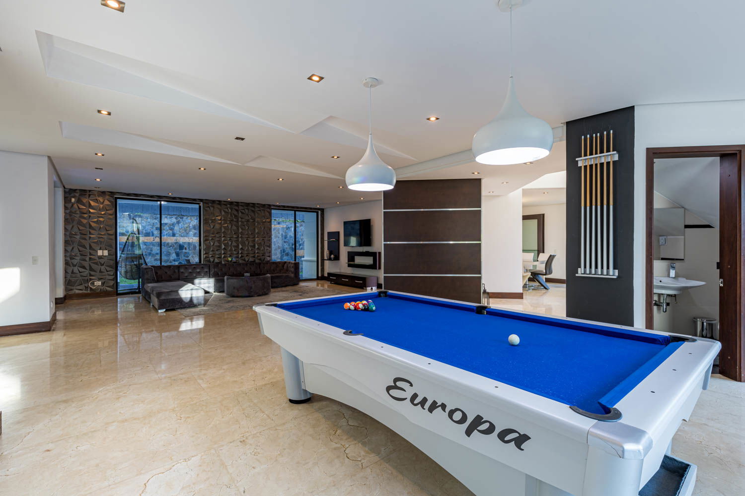 "Savor Unforgettable Moments: Experience Fine Dining in the Elegant Ambiance of our Medellin Villa's Dining Room"