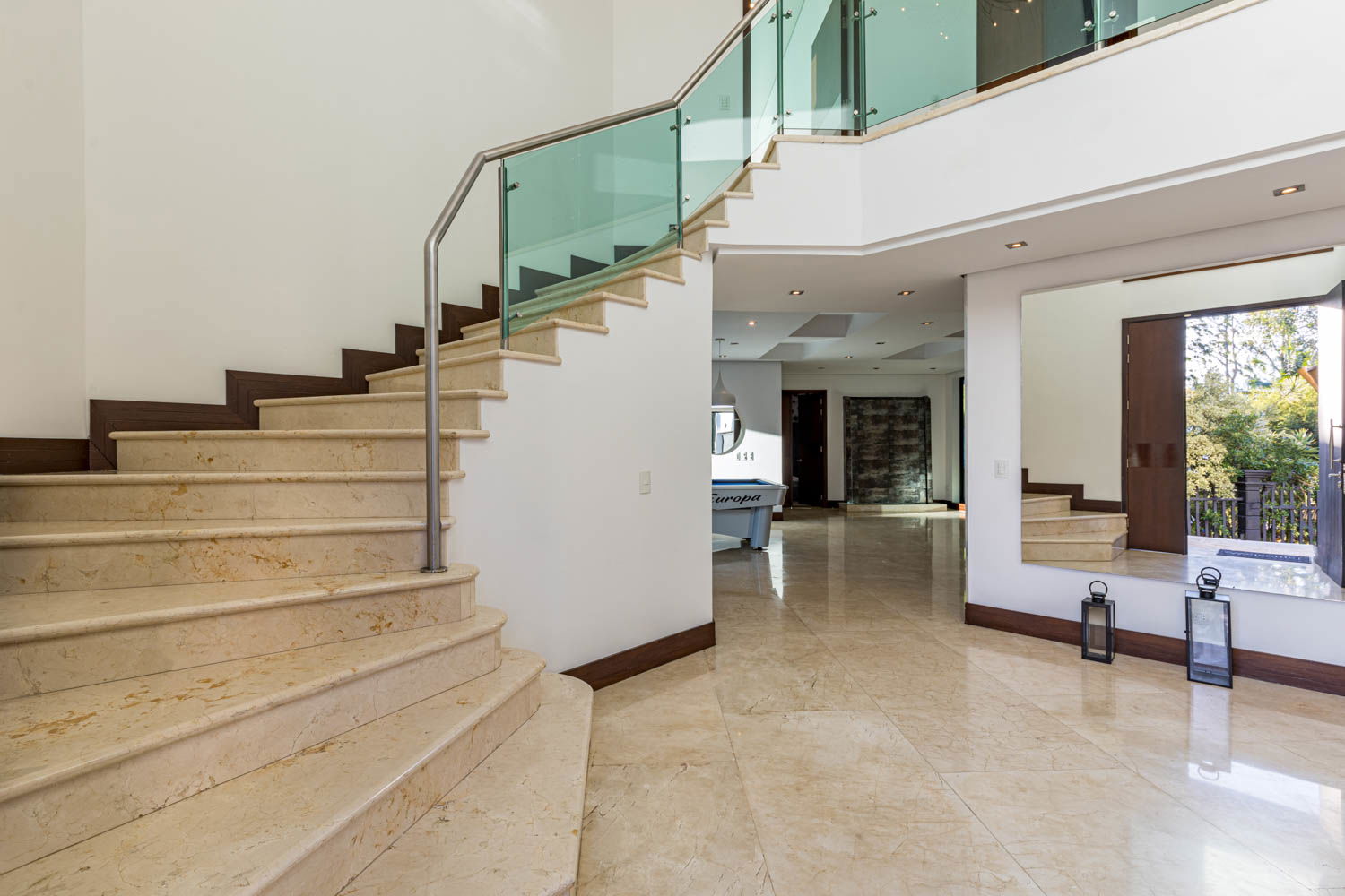 "Savor Unforgettable Moments: Experience Fine Dining in the Elegant Ambiance of our Medellin Villa's Dining Room"