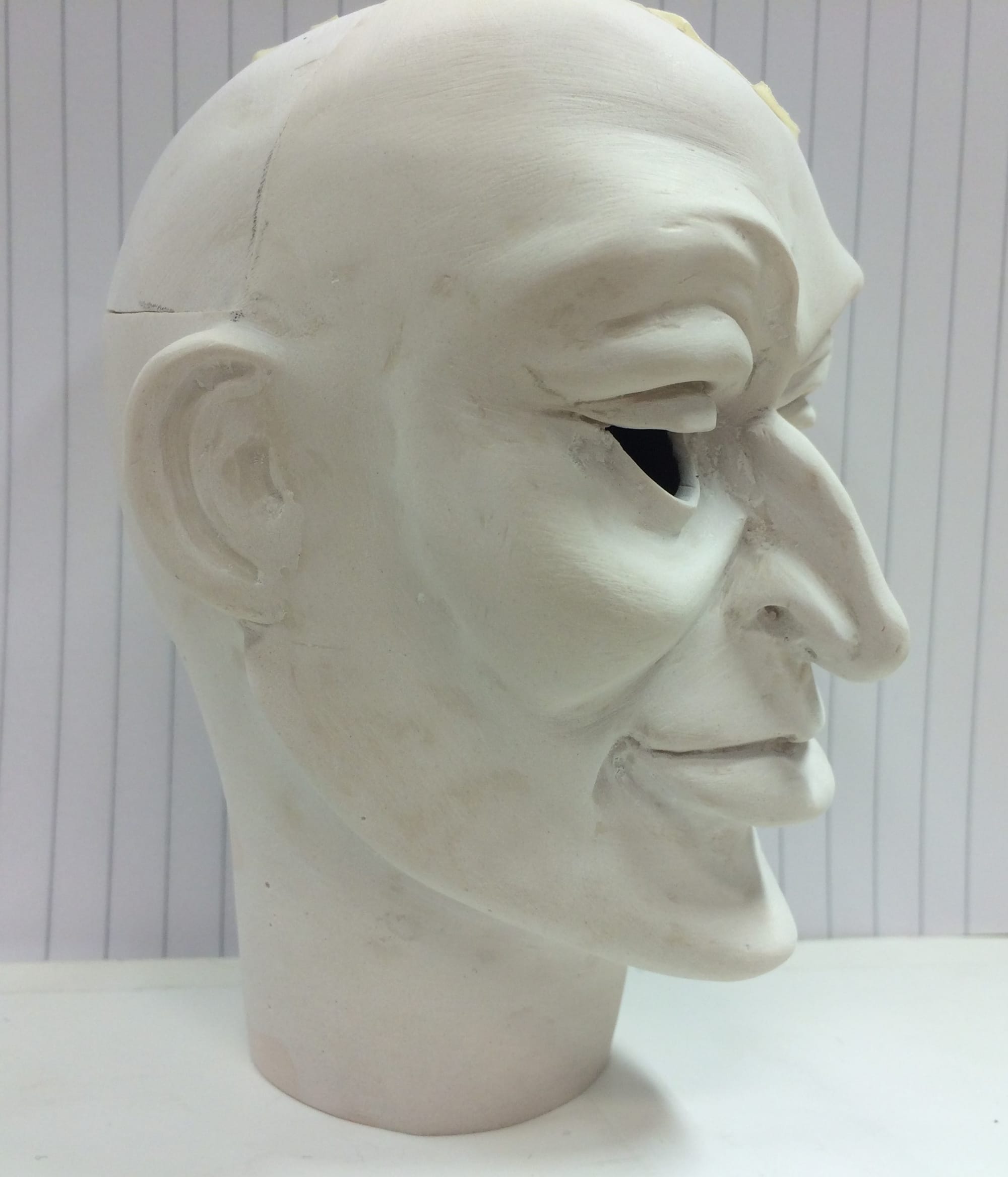 Grey haired caveman resculpted by Lee Allwood