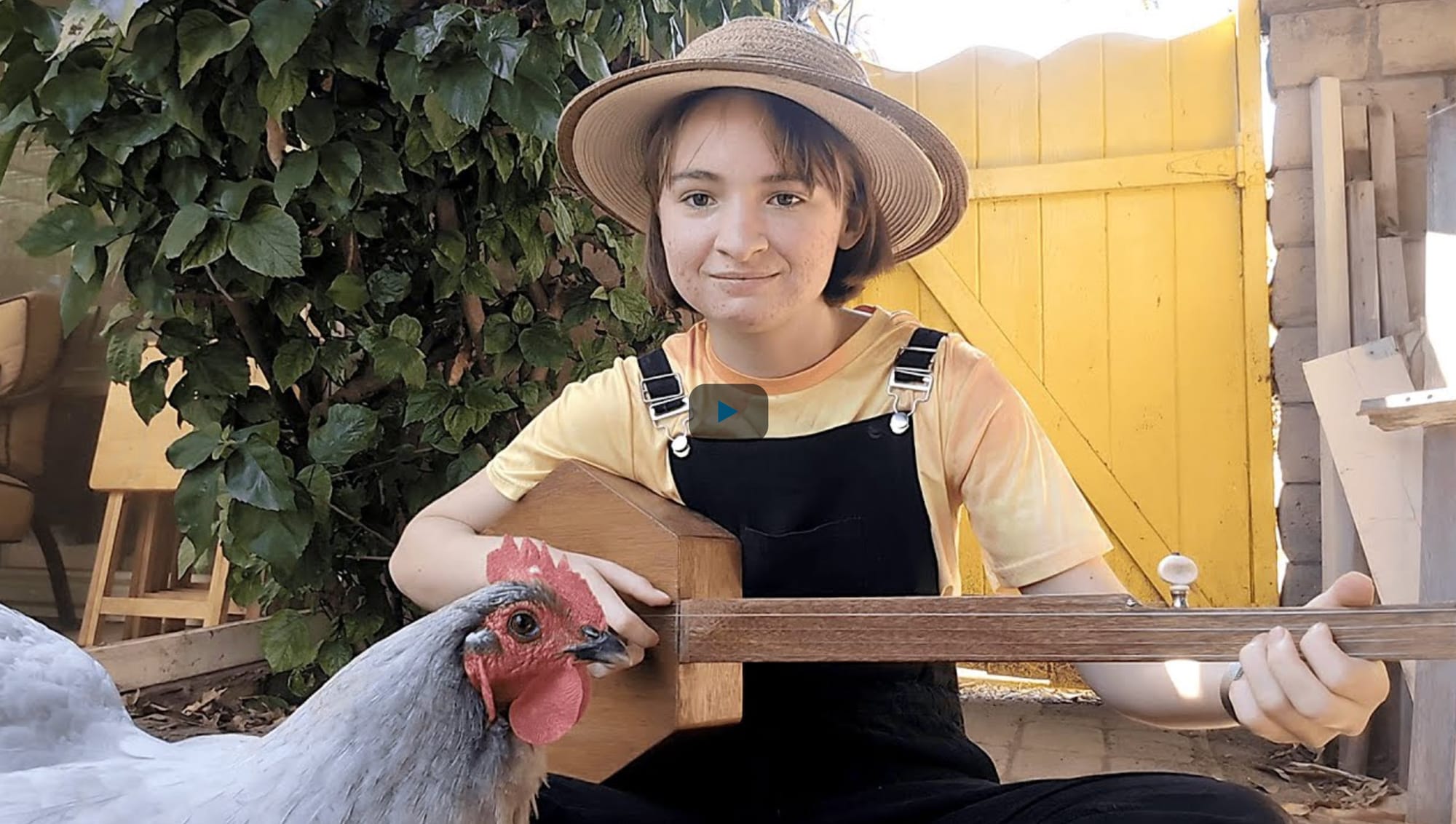 Woman Plays “Down In The River To Play” On Banjo But Her Chicken Steals The Show