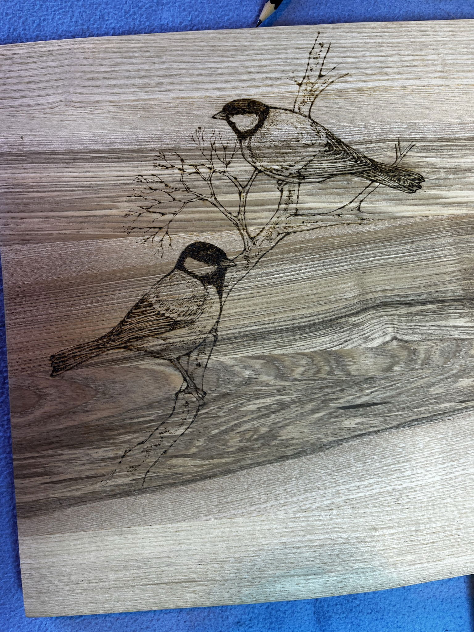 Pyrography on boxes, mirrors and furniture.