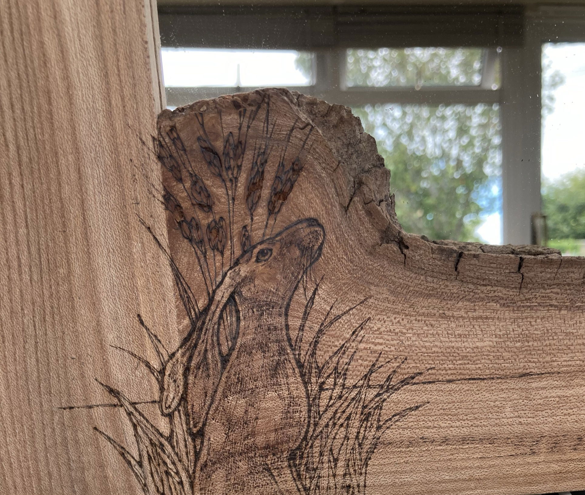 Pyrography on boxes, mirrors and furniture.