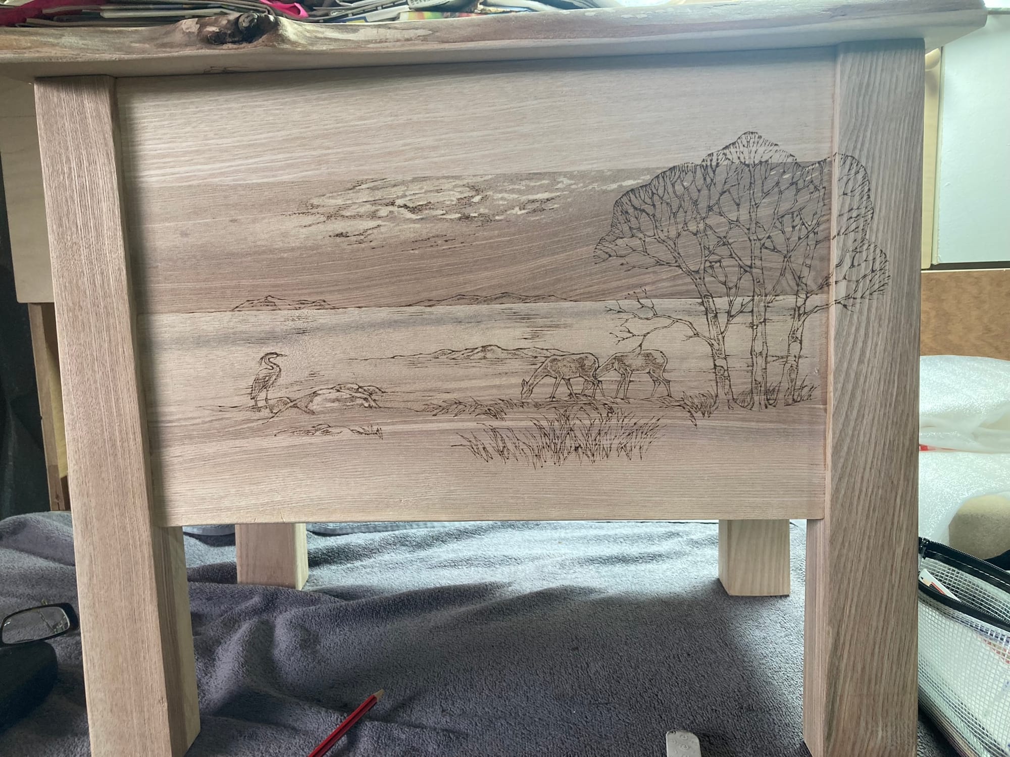 Pyrography on boxes, mirrors and furniture.