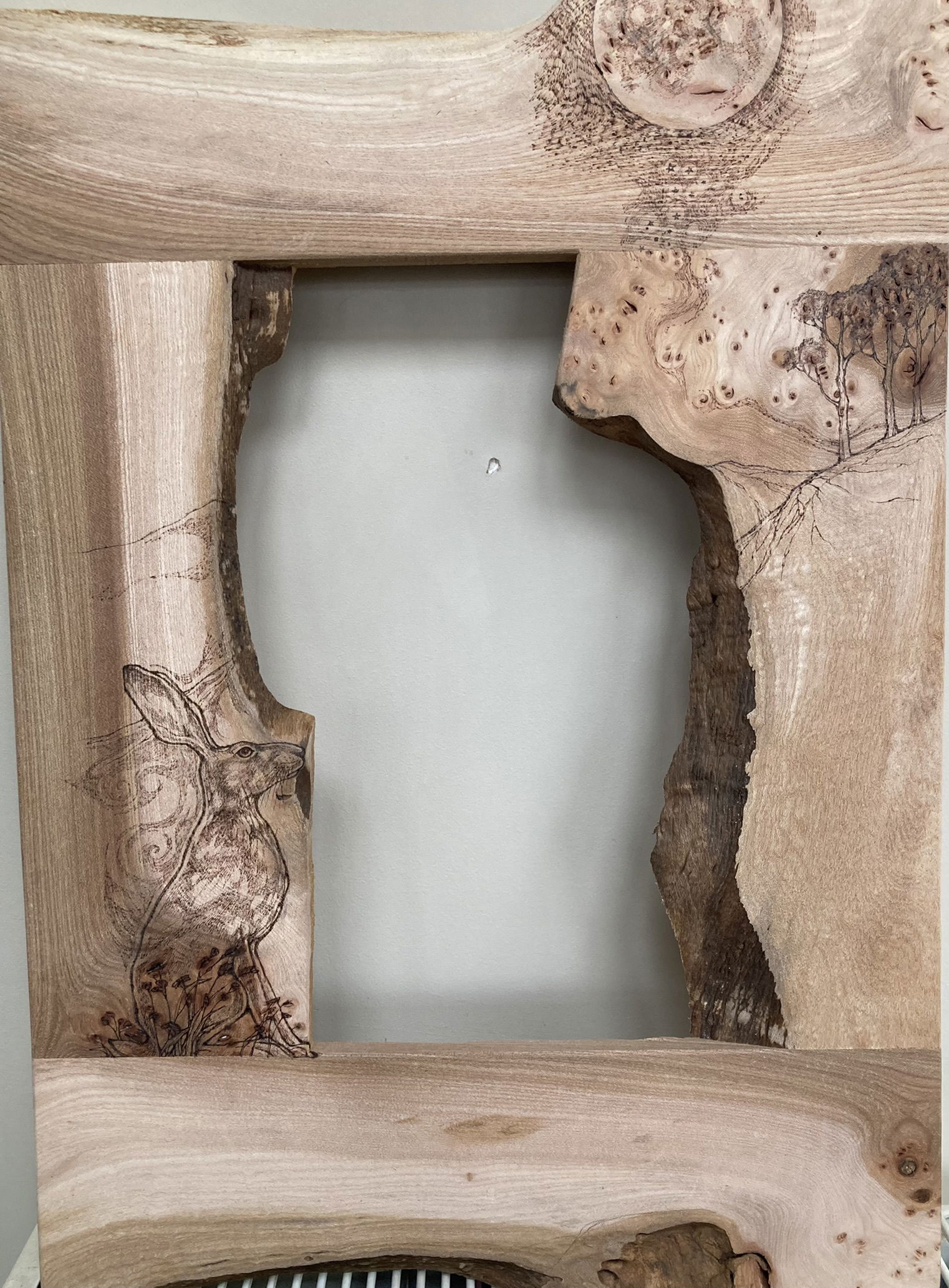 Pyrography on boxes, mirrors and furniture.