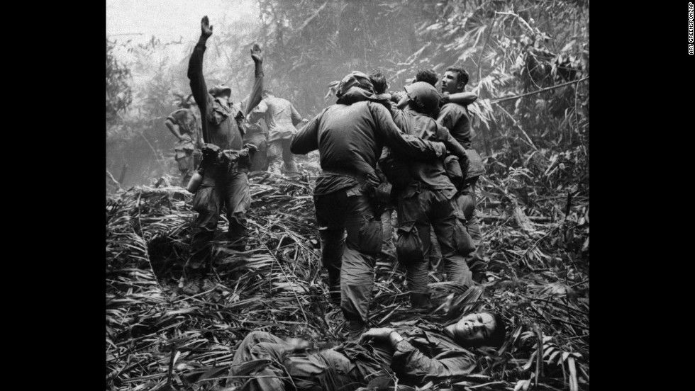 Vietnam War,  soldiers aiding wounded comrades
