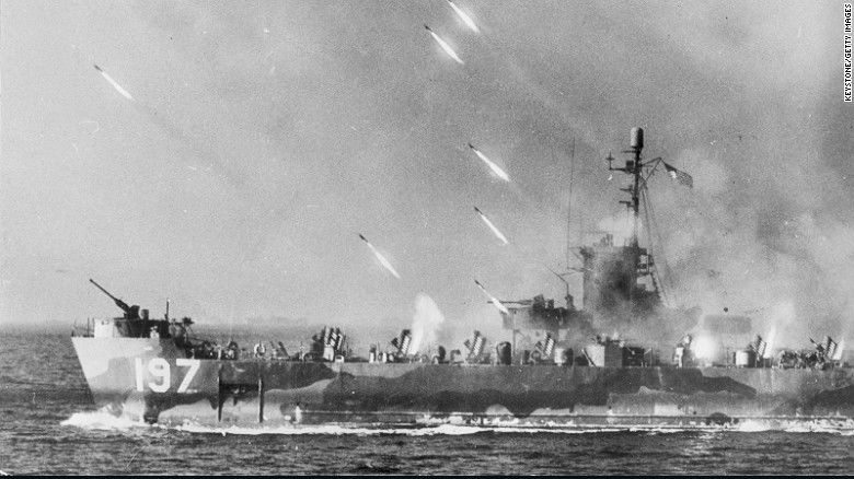 World War 2, Spring 1945, Rockets from an American warship stream toward Okinawa Island prior to the invasion