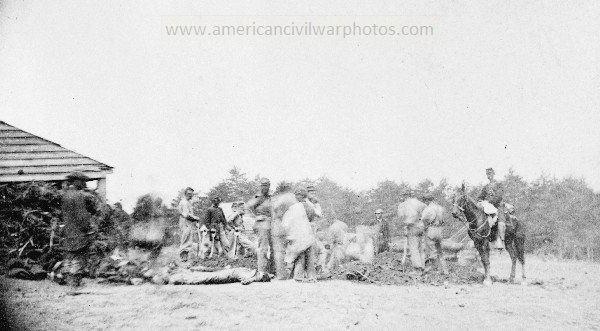 Civil War Scene of Ewell's attack, May 19, 1864, near Spottsylvania i.e. Spotsylvania Court House. 1st Mass. Artillery burying the dead.
