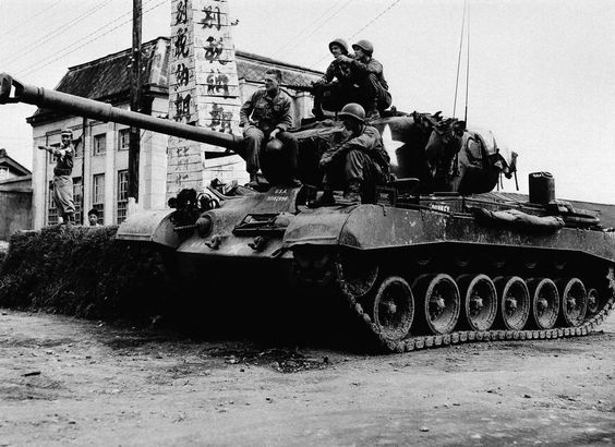 Korean War U.S. troops sit atop a death-dealing medium tank on Sept. 14, 1950, in Gyeongju at a defense position