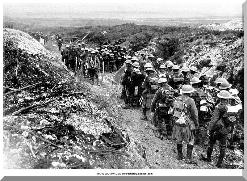 World War 1 British soldiers move forward in the shelter of the stream
