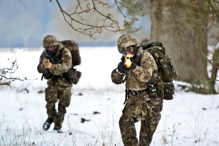 Iraq War Soldiers assault the ‘enemy’ during a training session.