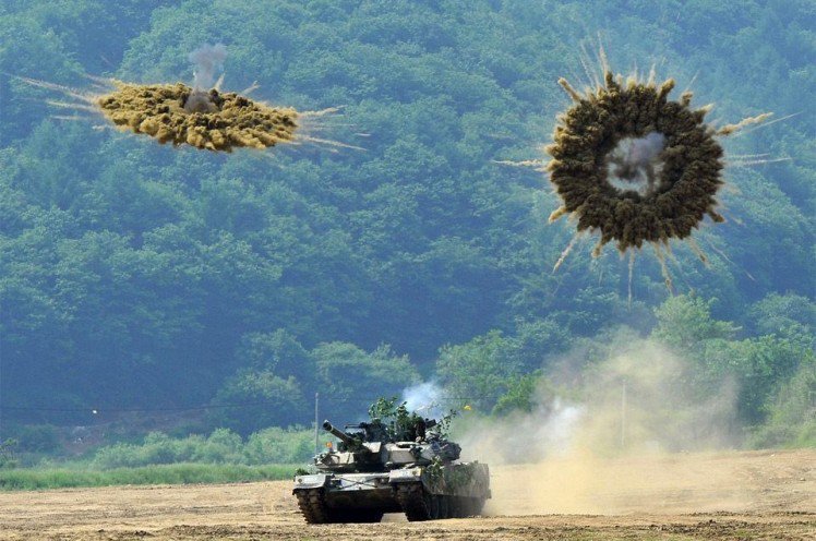 Iraq War South Korean K1 tank fires smoke shells during a joint military drill between South Korea and the US in Paju near the border with North Korea.