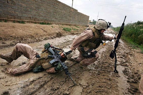 Iraq War October 31, 2006 Marine Sgt. Jesse E. Leach drags a comrade shot by a sniper while patrolling in Garma.