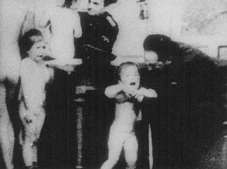 World War 2 German officers examine Polish children to determine whether they qualify as  Aryan.  Poland, wartime