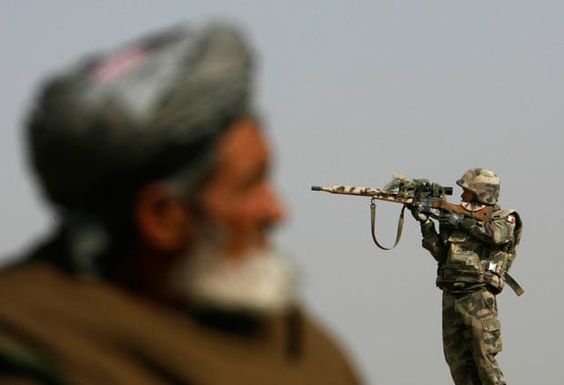 Afghanistan War November 20, 2007, A French sniper looks through his rifle's scope while keeping watch over Qarabagh district, about 40 km (25 miles) north of Kabul
