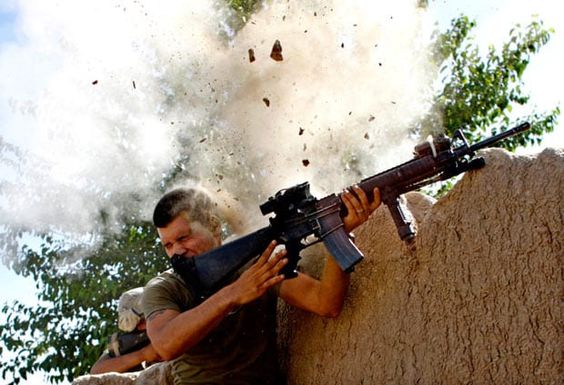 Afghan War May 18, 200, Sgt William Olas Bee, a US Marine from the 24th Marine Expeditionary Unit, has a close call after Taliban fighters opened fire near Garmsir in Helmand Province, Afghanistan