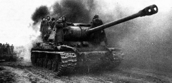 World War 2 German troops inspecting a IS2 put out of action in a village in East Prussia. Autumn 1944.