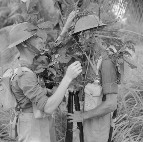 World War 2 British troops camouflage themselves while training in the Malayan jungle, November 1941.
