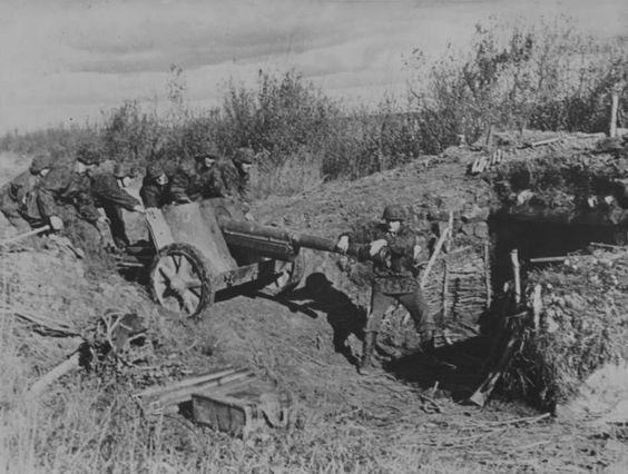 World War 2 SS troops lining a Pak 38 . 75cm