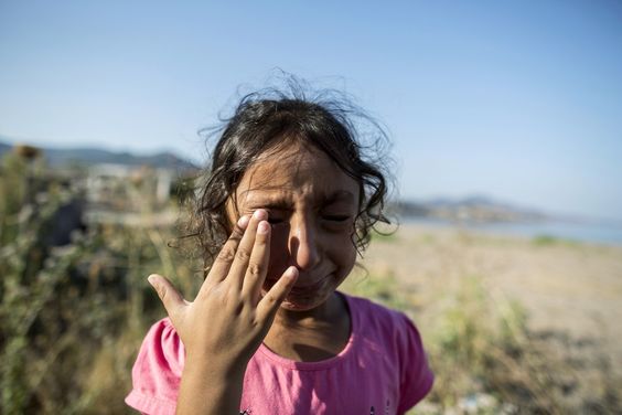 Iraq War Yasmine, a 6-year-old from Deir Al Zour, Syria, cries at the beach after arriving at Lesbos, Sept. 11, 2015.