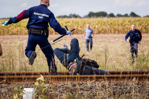 Iraq War A refugee breaks out of a holding area and runs away from police in Roszke, Hungary, Sept. 8, 2015.