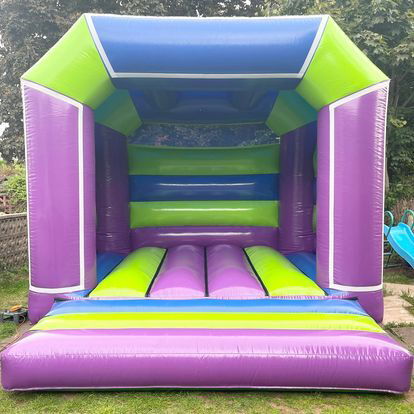 Multi coloured, purple fronted bouncy castle