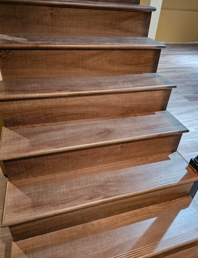 Stairs beautifully Finished with vinyl treads and risers.
